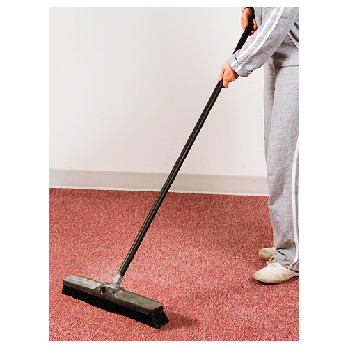 A person sweeping the floor with a broom